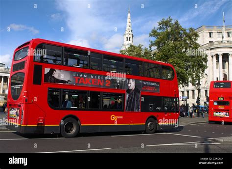 Red London double decker buses traveling in London Stock Photo - Alamy