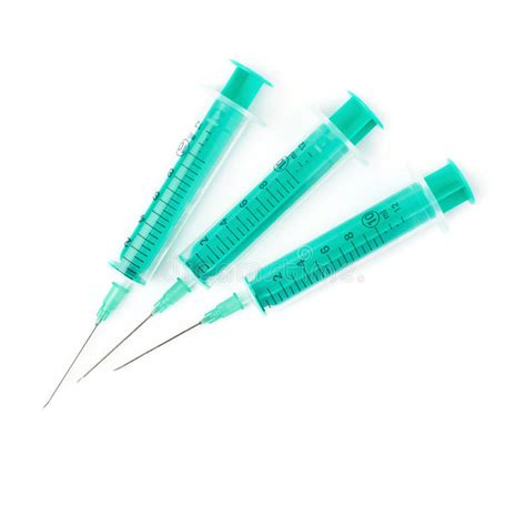 Medical Syringes With Needles Lying Isolated Over White Background