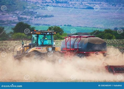 Farmer In Tractor Preparing Land With Seedbed Cultivator Stock Image