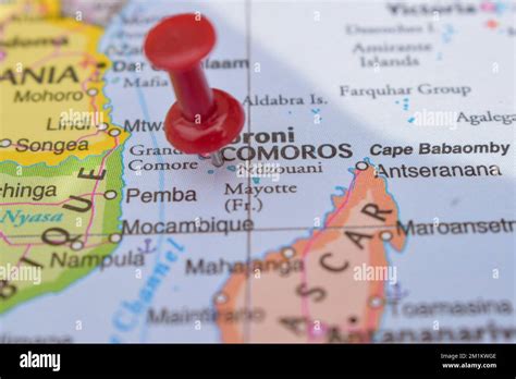 Red Push Pin Pointing On Location Of Comoros World Map Close Up View