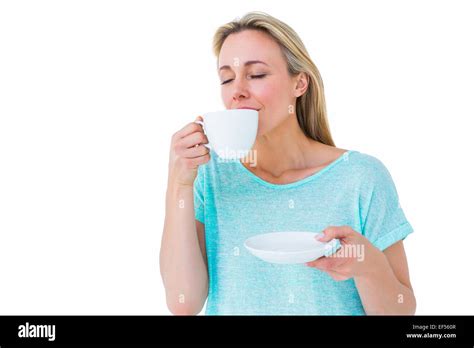 Peaceful Blonde Drinking Hot Beverage With Eyes Closed Stock Photo Alamy