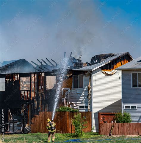 Firefighter at a Structure Fire Stock Photo | Adobe Stock