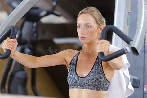 Woman Doing Arm Exercises In Gym Stock Photo Image Of Focused