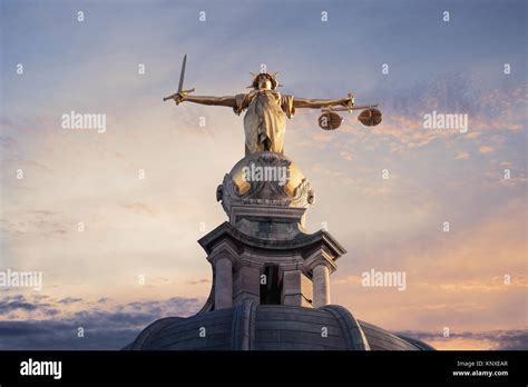 Gold Lady Justice Statue On The Top Of The Old Bailey In London