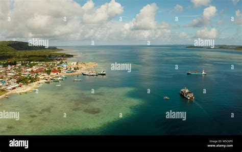 Passenger Port With Ferries And Cargo Ships On The Island Of Siargao