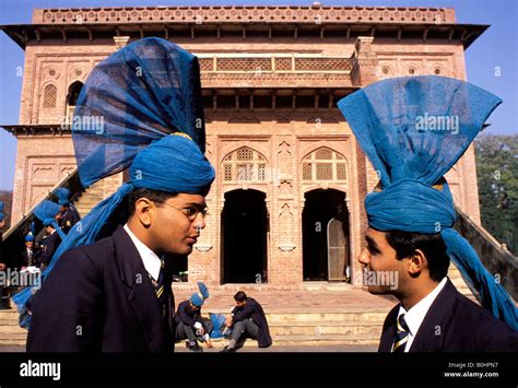 Two Male Students Wearing The Traditional School Uniform At Aitchison