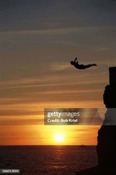 Man Diving Silhouette Photos And Premium High Res Pictures Getty Images