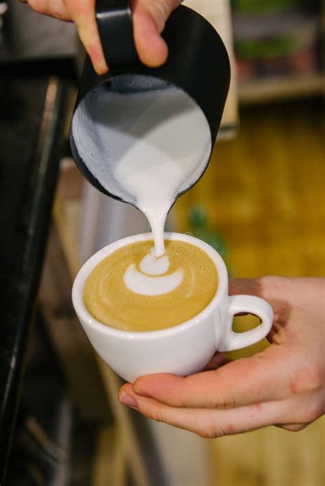 Barista Pouring Milk Into A Cup Of Coffee Stock Photo Image Of Cafe