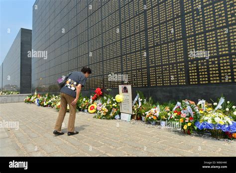 A Chinese woman mourns for the victims of the 1976 Tangshan Great Earthquake at the Tangshan ...