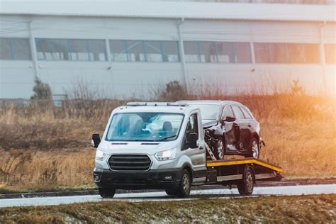 Premium Photo Emergency Roadside Assistance In Action As A Tow Truck