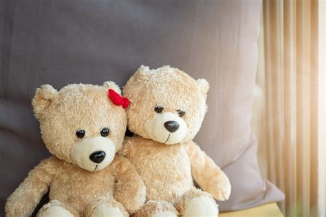 Free Photo Two Teddy Bears On Wood Background