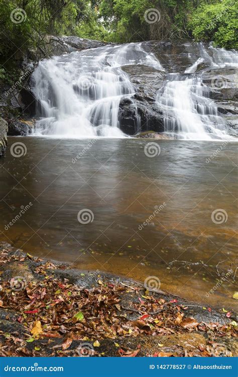 River Flowing Over Rocks And The Debengeni Waterfall Stock Image