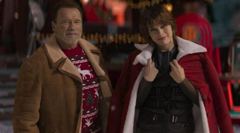 Arnold Schwarzenegger And Milla Jovovich Created A Christmas Mood In