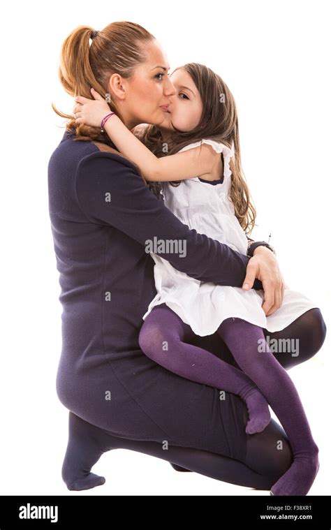 Daughter Kissing Her Mother Isolated On White Background Stock Photo