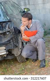 Mechanic Assessing Car Stock Photo Shutterstock