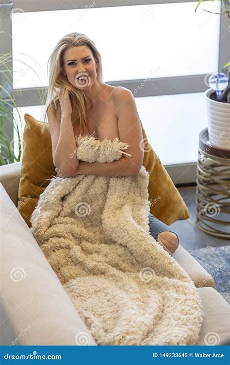 Gorgeous Blonde Model Poses Topless While Lounging In A Home Environment Stock Image Image Of
