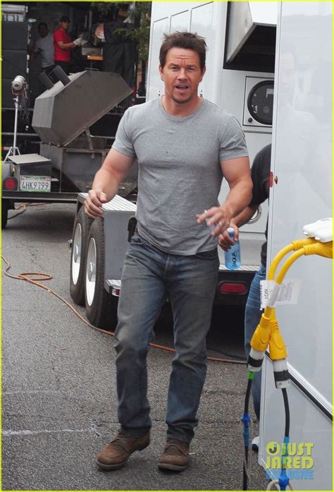 Mark Wahlberg Wears A Tight Gray T Shirt And Shows Off His Big Muscles