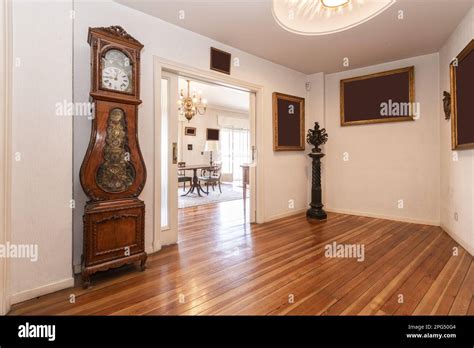 Hall Of A House With Beautiful Long Plank Wooden Floors A Grandfather