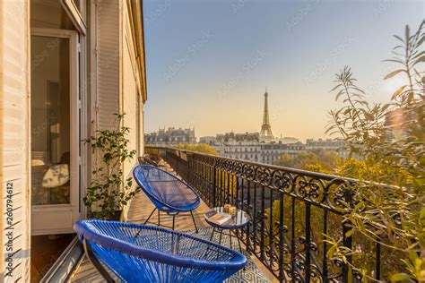 beautiful paris balcony at sunset with eiffel tower view Stock Photo ...