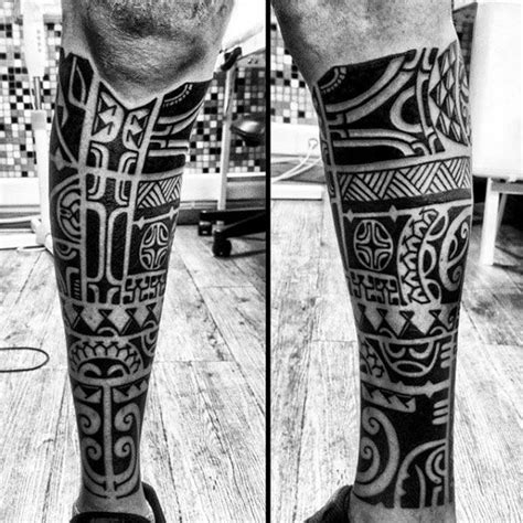 Black And White Photo Of A Man S Leg With An Intricate Tattoo Design On It