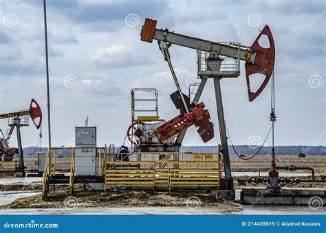 Crude Oil Pump Jack At Oilfield On Sunset Backround Fossil Crude