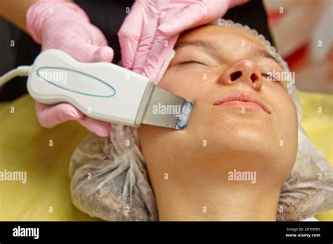 Close Up Ultrasonic Face Cleaning Modern Equipment Beautician Does