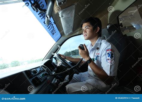 Driver Of Ambulance Contacts Team With Radio Communication Editorial