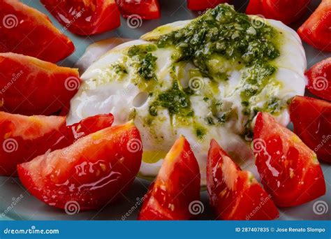 Buffalo Mozzarella Burrata Topped With Pesto Sauce And Tomato Slices Stock Image Image Of