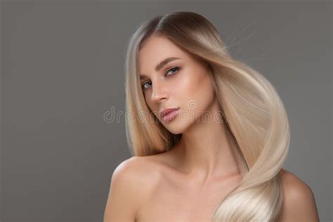 Portrait Of A Beautiful Woman With Long Straight Hair And Makeup