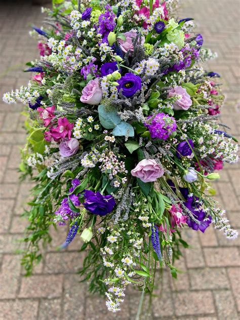 Purple And Lilac Casket Spray Welwyn Florist