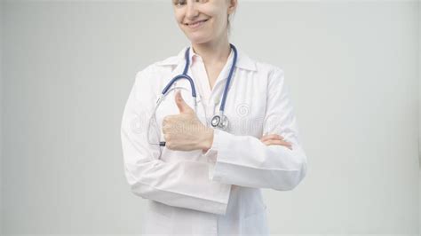 Portrait Of An Attractive Young Female Doctor In White Coat Stock