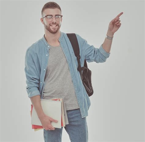 Um Estudante Do Sexo Masculino Uma Mochila Segurando Livros