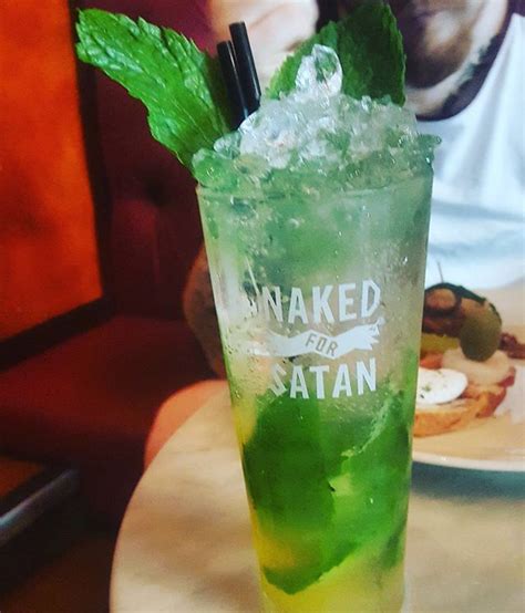 A Green Drink Sitting On Top Of A Table