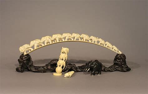 Lot - A Chinese ivory tusk carving, tusk length: 23 1/2 in. (60 cm)