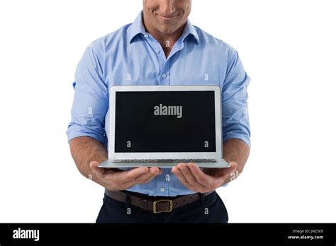 Male Executive Holding Laptop Against White Background Stock Photo Alamy