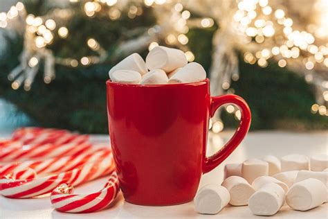 Red Mug Of Cocoa With Marshmallows On Christmas Background Creative