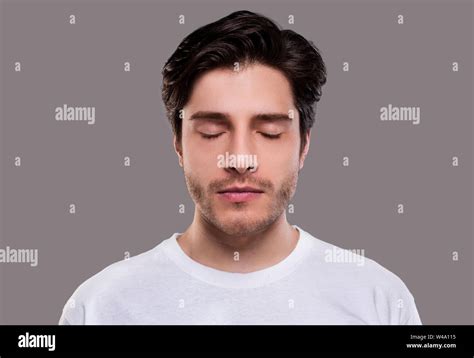 Portrait Of Handsome Millennial Man With Closed Eyes Stock Photo Alamy