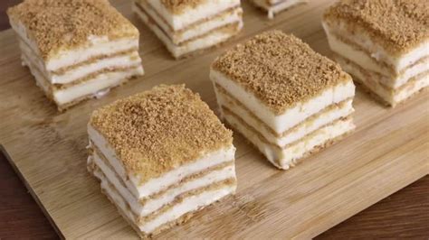 Several Pieces Of Cake Sitting On Top Of A Wooden Cutting Board