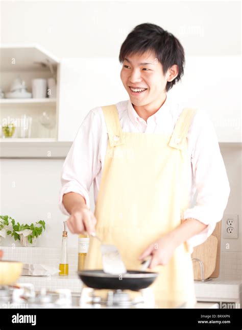 A Young Man Cooking Stock Photo Alamy