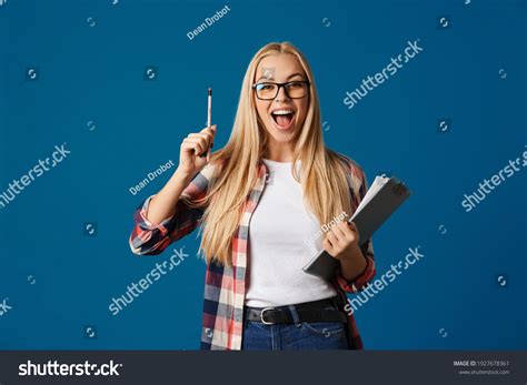 Excited Blonde Girl Exclaiming While Posing Stock Photo