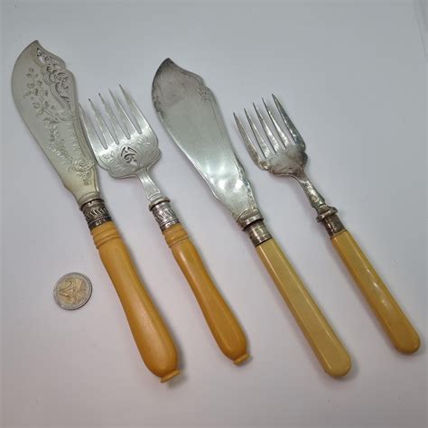 Two Pairs Of Attractively Marked Silver Epns Fish Knives And Forks With