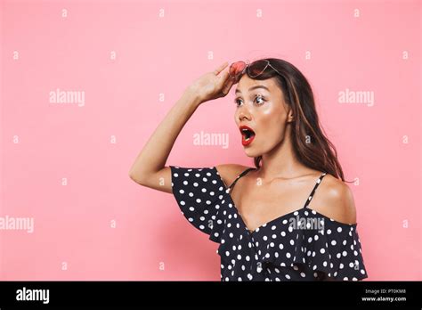 Shocked Brunette Woman In Dress Take Off Sunglasses And Looking Away