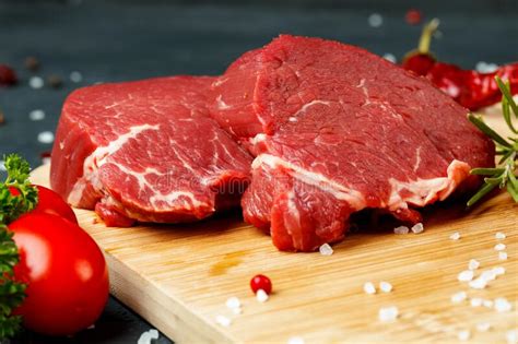 Raw Beef Fillet Piece On Wooden Board Close Up Stock Photo Image Of