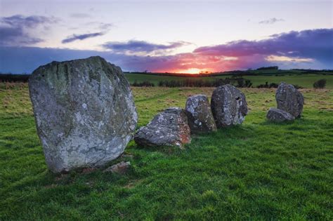 Rock Formation on Green Grass Field · Free Stock Photo