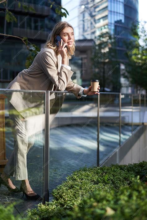 Free Photo Stylish Office Woman In Beige Suit Talking On Mobile Phone