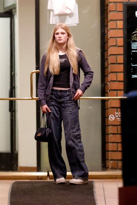 Claudia Schiffer In Black Jacket Under T Shirt With Cargo Pants Outfits