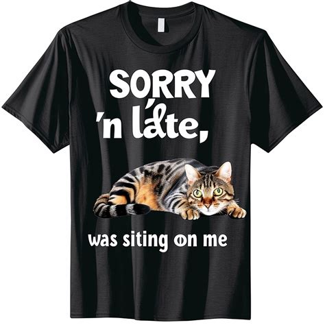 Stand Out In Style With Our Quirky Black T Shirt Featuring A Cute Tabby Design And A Hilarious