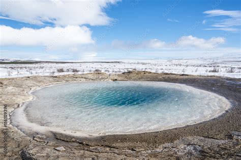 Blue geyser and hot springs in Strokkur. Winter view. Golden circle ...