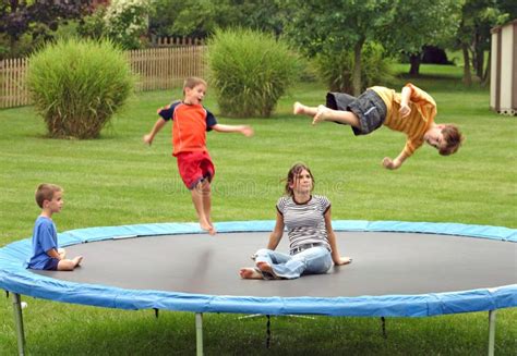 Child Jumping On Trampoline