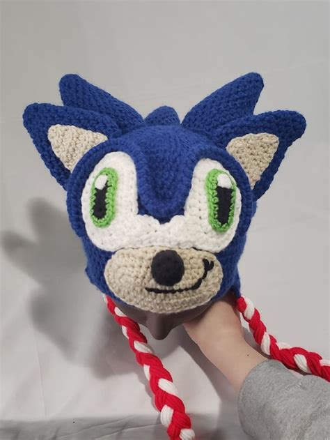 A Hand Holding A Knitted Sonic The Hedgehog Hat